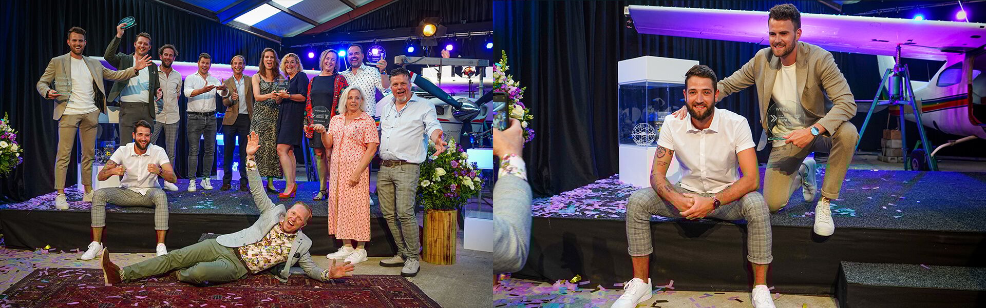 Feest met confetti; twee mannen nemen speelse poses aan bij een vliegtuig in een hangar.