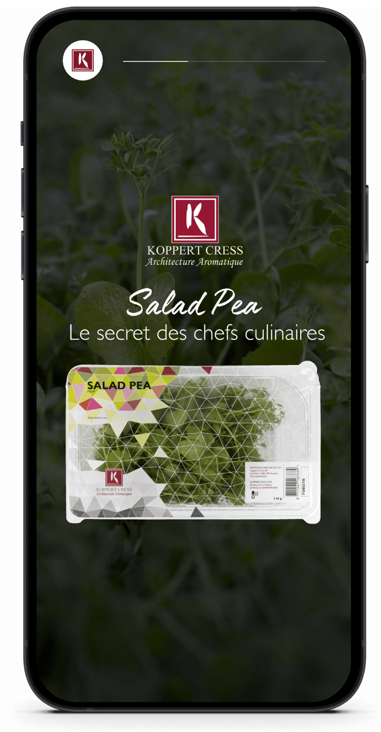 Koppert Cress Salad Pea pops op een smartphone, in harmonie met een frisse groene bladachtergrond.